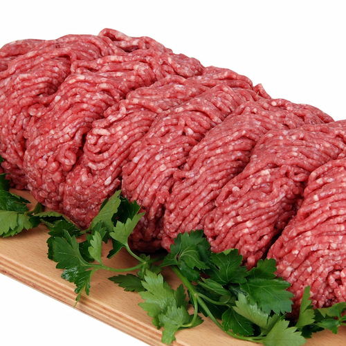 Ground beef on a wooden cutting board
